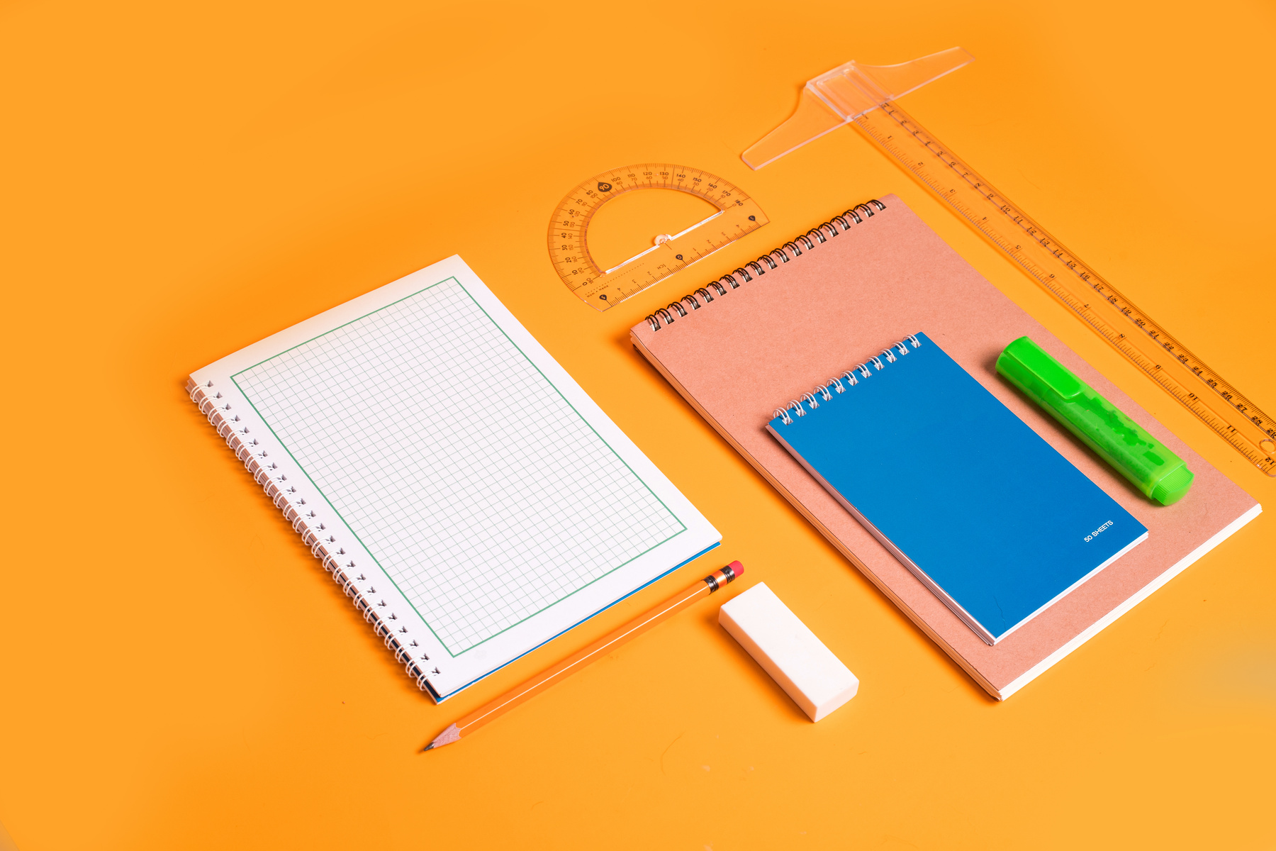 School Supplies on Orange Background